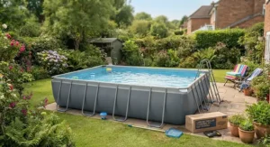 A complete large rectangular frame pool set installed on a patio area, suitable for garden use.