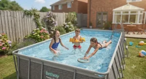 Children playing safely in a shallow Best Power Steel pool during the school summer holidays.