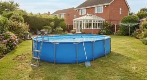 A fully assembled oval frame pool ready for summer use in a typical UK lawn, highlighting its sturdy structure.