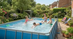 Children playing in a durable large rectangular frame pool on a sunny day in the UK.