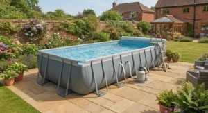 A sturdy steel frame rectangular above ground pool set up on a patio.