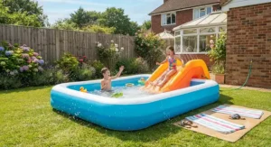Fun family paddling pool featuring an attached water slide and splash zone for summer holidays