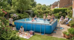 A wide-angle shot of a family-sized large rectangular frame pool during a UK bank holiday weekend.