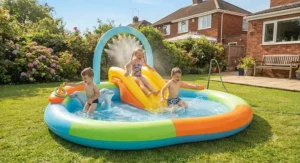 An action-packed play centre family paddling pool with an attached slide and water sprayer for kids