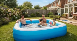 Parents relaxing with their children in a sturdy family paddling pool during a warm weekend