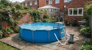 A round frame pool with filter pump featuring a safety ladder for secure entry and exit in the garden.