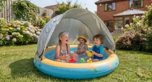 Young children cooling off in a paddling pool with a removable UV protection canopy