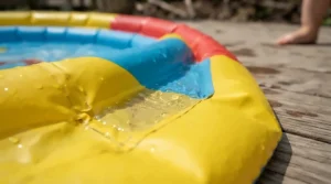 Close-up of a baby pool with canopy for newborns highlighting the safe, shallow water depth.