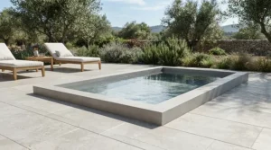 A minimalist concrete compact plunge pool for patio zones with clean architectural lines.