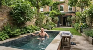 Compact cold water plunge pool fitted into a small London townhouse garden.